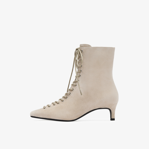 73hours女鞋混搭美学2025冬季新品尖头细跟系带时装靴