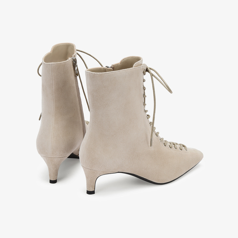 73hours女鞋混搭美学2025冬季新品尖头细跟系带时装靴