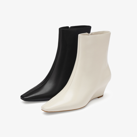 73hours女鞋都市剪影2025冬季新品坡跟尖头纯色时装靴
